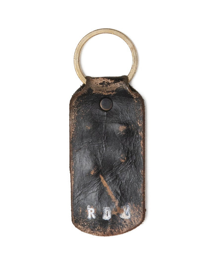 Each keychain tells its own story — cut, aged, and finished by hand in Haven St. by Mr. Fat himself.

Made from full-grain leather that’s been deliberately distressed, the surface bears natural scuffs, patina, and burnished edges that only come from real hands and real work. Every piece is unique — no two wear the same scars.